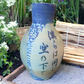 Wheel-Thrown Pottery Art Piece- Glazed and Fired Vase, Asian Inspired Design w/ Crane, Plants and Asian Symbols, Blue and Ivory, Interpretation: "We are all under the same sky" Dimensions:  11.75h" x 7.5w"